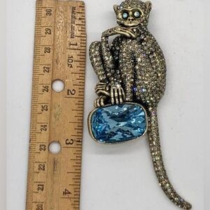 Heidi Daus Sparkling Monkey Brooch with Blue Gem